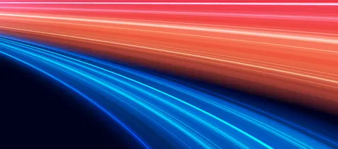 Blue and red streaks of light against a dark background